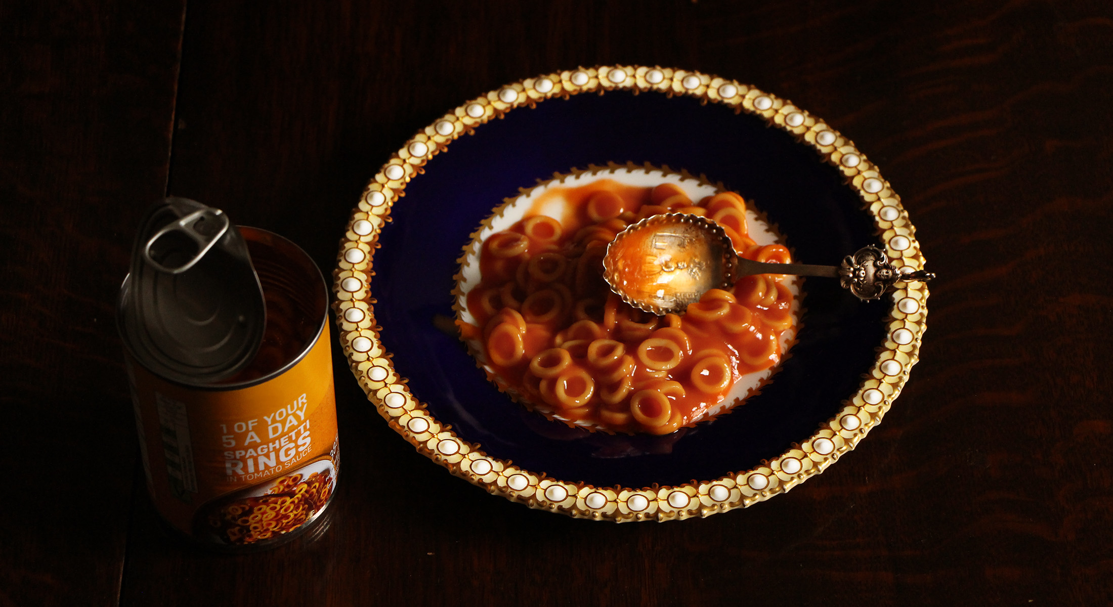 Fancy plate with spaghetti hoops on it.