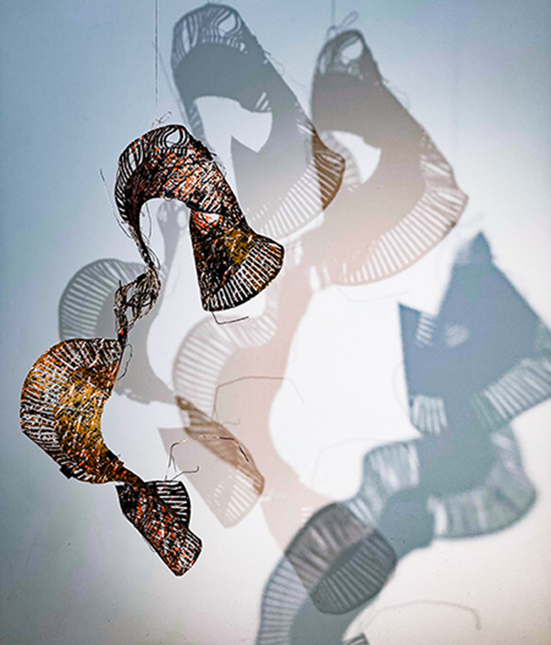 screen printed paper sculpture creating shadow and video
